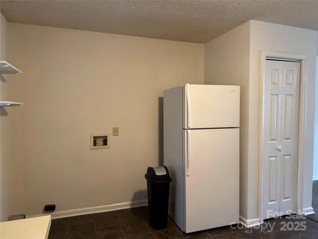 a utility room with sink dryer and washer