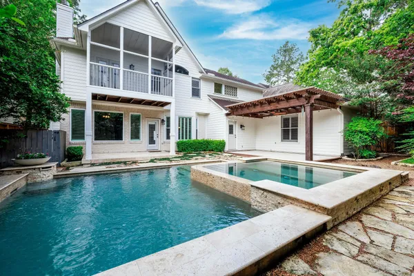 a view of a swimming pool with a yard