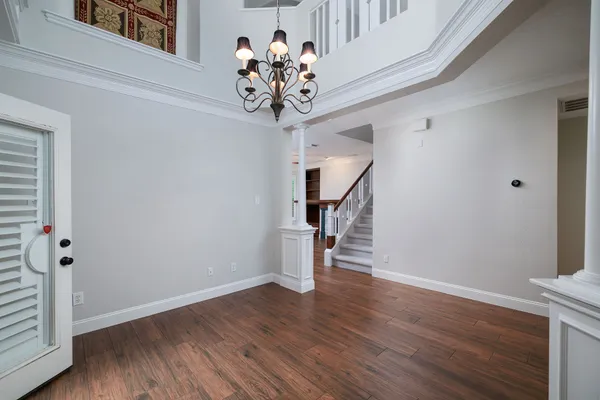 a view of an entryway with wooden floor