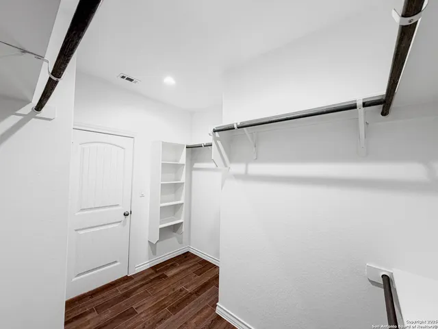 a view of an empty walk in closet