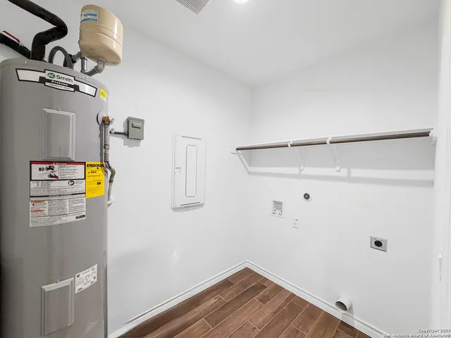 a view of storage and utility room with racks on the wall