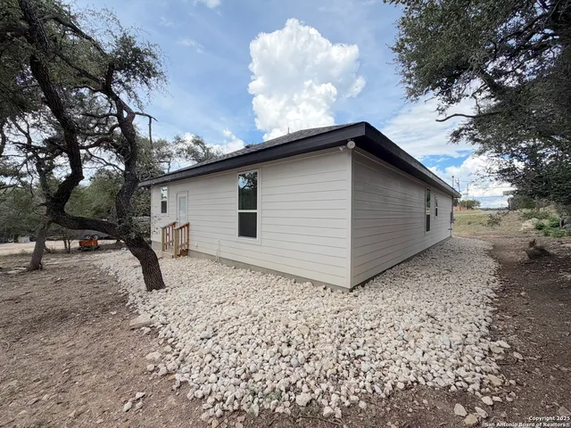 a backyard of a house with lots of green space