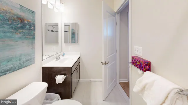 a bathroom with a toilet and a bathtub