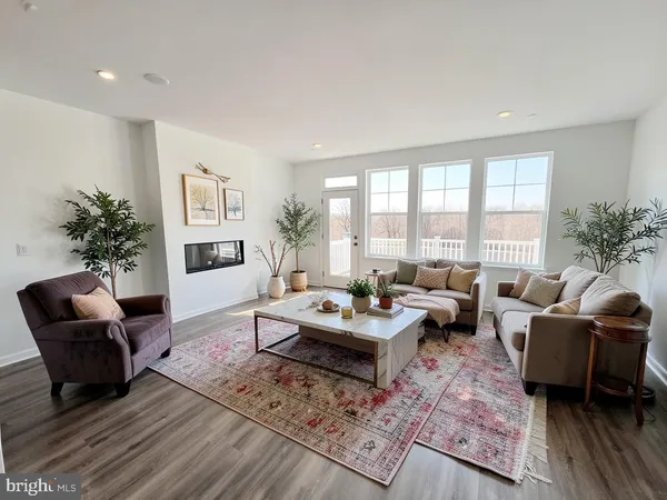 a large kitchen with kitchen island a counter top space a sink and appliances