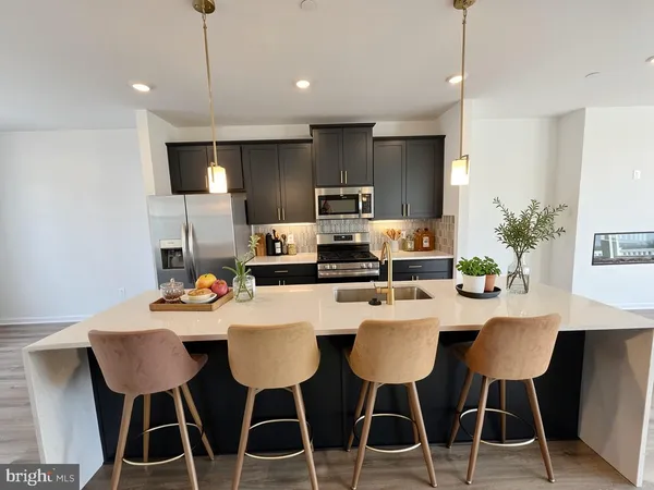 a room with a wooden floor and cabinets