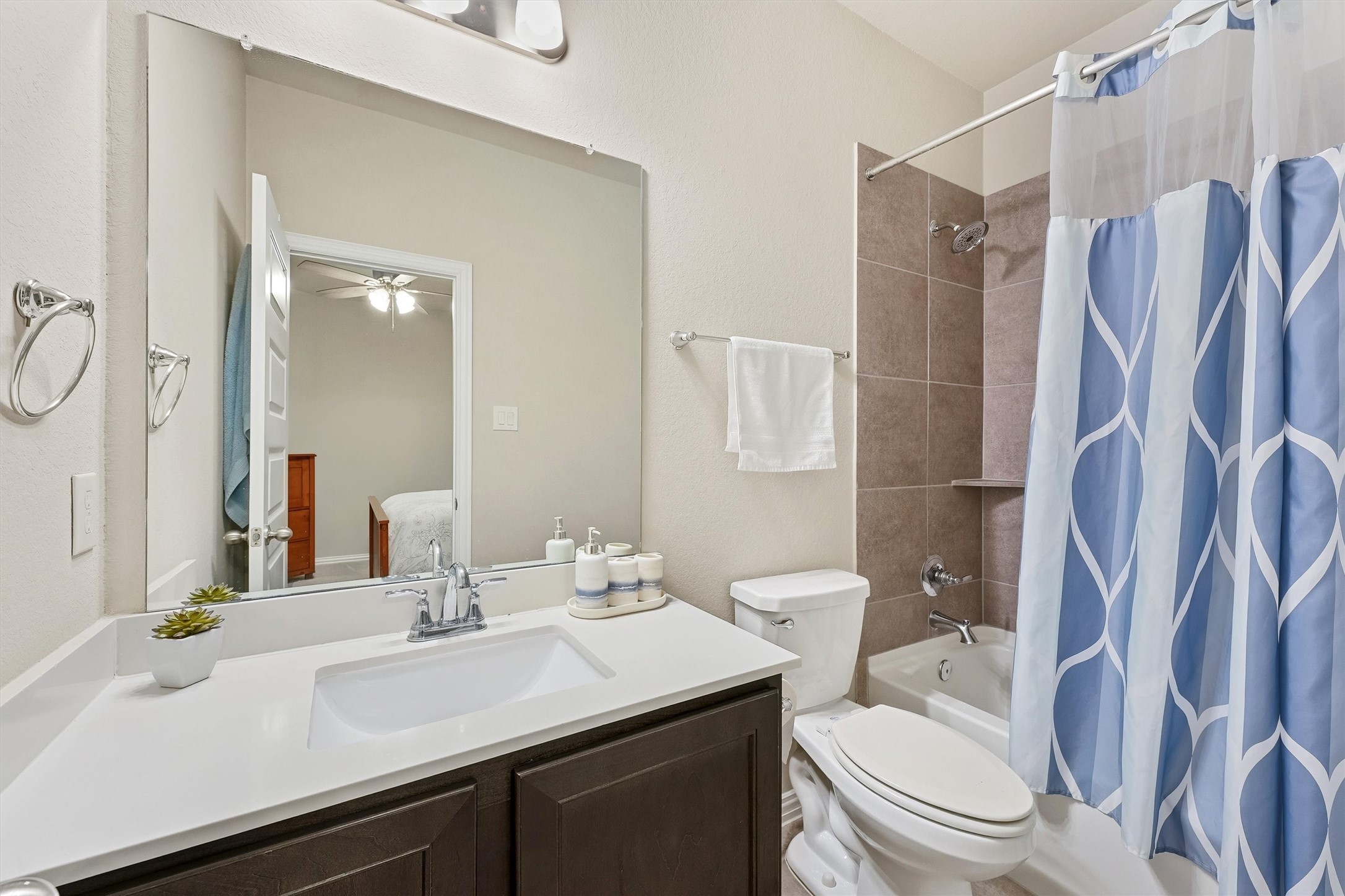7119 Mystic Morning Lane Spring, TX 77379 - Photo 13 of 30 a bathroom with a sink toilet and shower