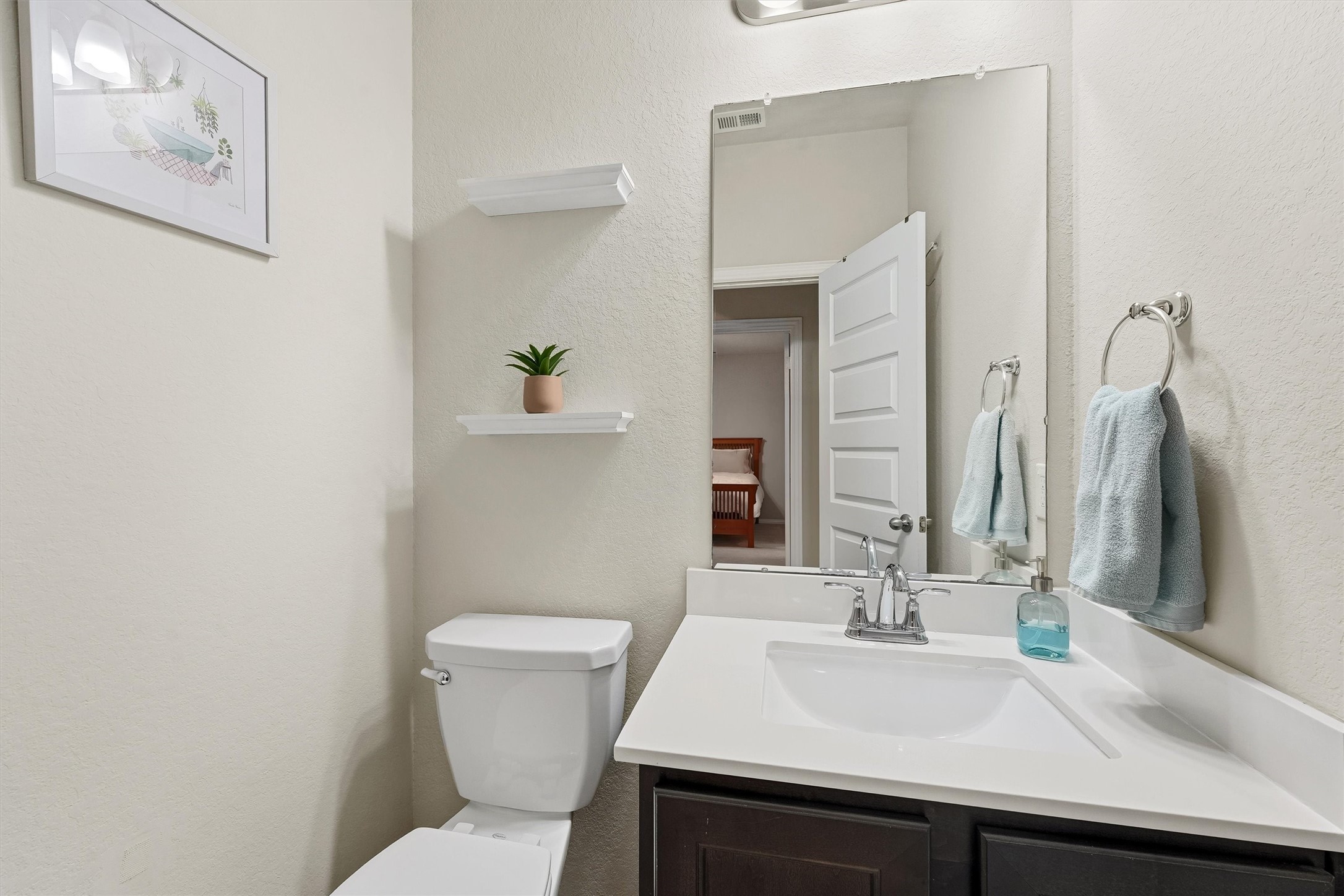 7119 Mystic Morning Lane Spring, TX 77379 - Photo 15 of 30 a bathroom with a sink a toilet and mirror