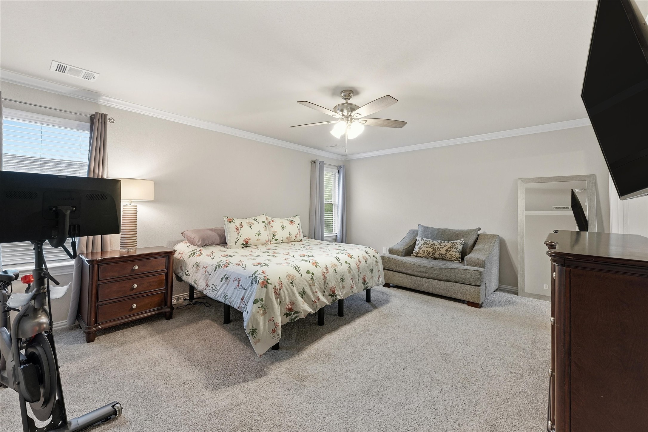 7119 Mystic Morning Lane Spring, TX 77379 - Photo 18 of 30 a spacious bedroom with a bed and a flat screen tv