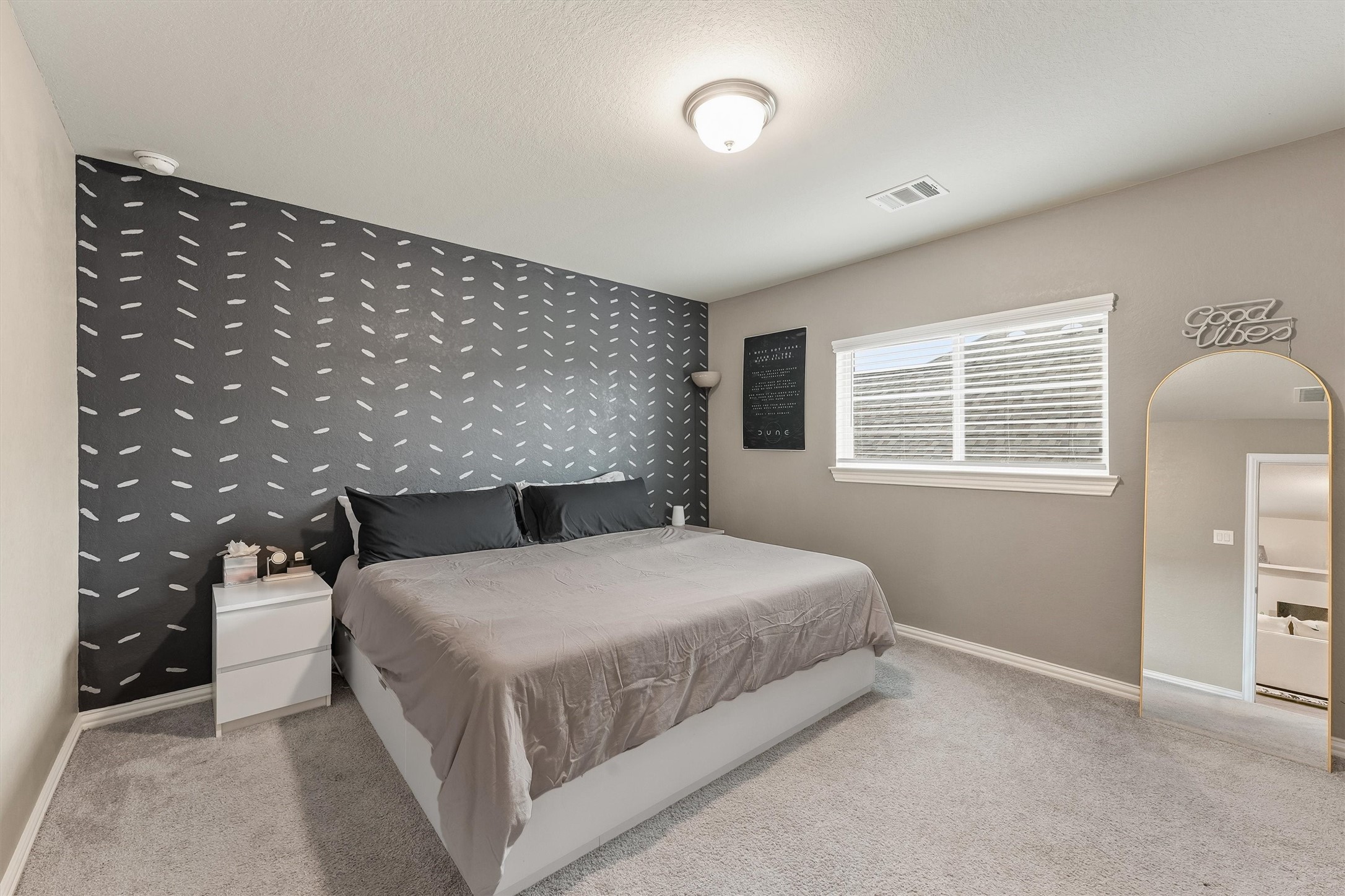 7119 Mystic Morning Lane Spring, TX 77379 - Photo 21 of 30 a bedroom with a bed and a night stand