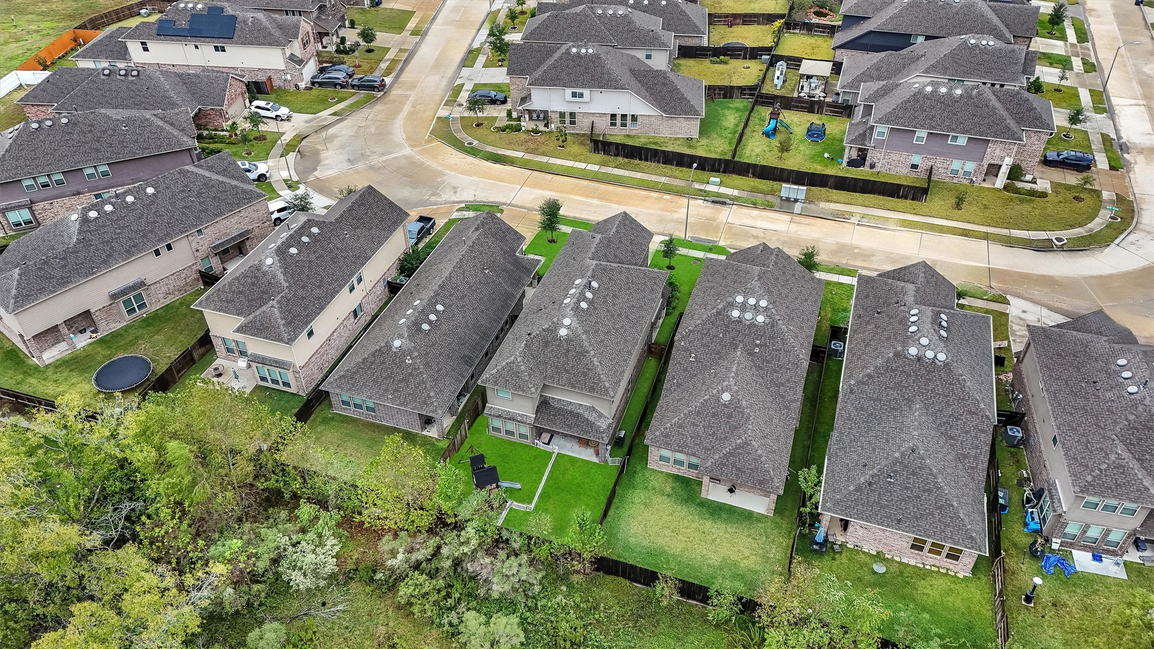 7119 Mystic Morning Lane Spring, TX 77379 - Photo 27 of 30 an aerial view of a house with a garden and lake view