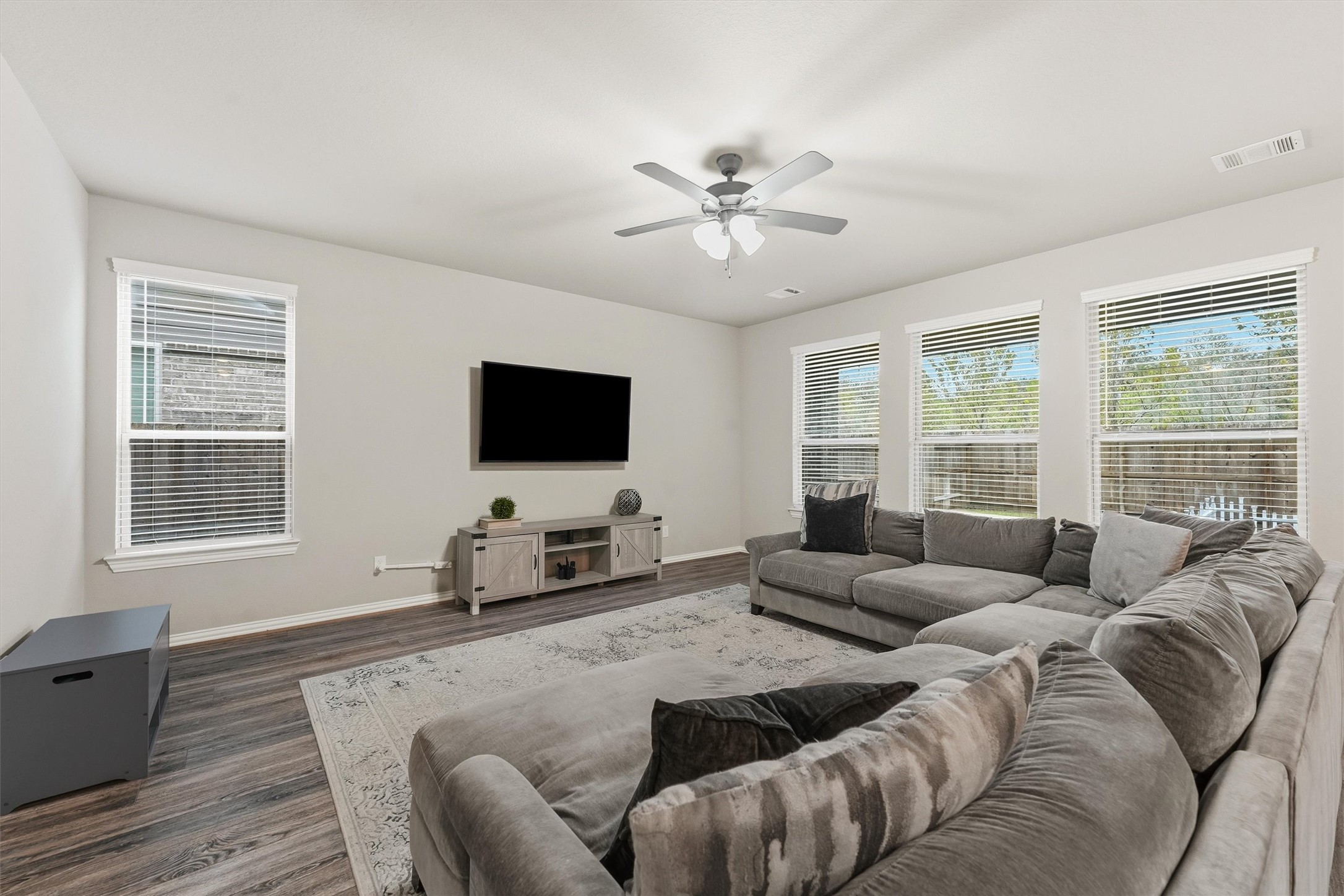 7119 Mystic Morning Lane Spring, TX 77379 - Photo 6 of 30 a living room with furniture and a flat screen tv