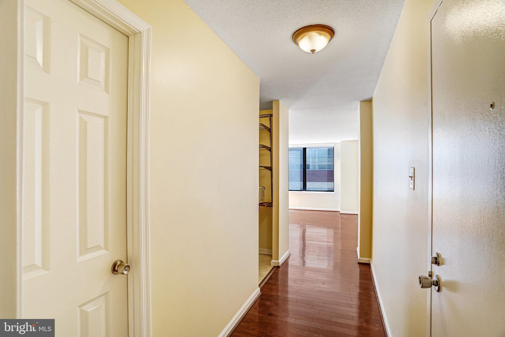 1301 20th Street Northwest, Unit 501 Washington, DC 20036 - Photo 5 of 19 a view of a hallway with wooden floor