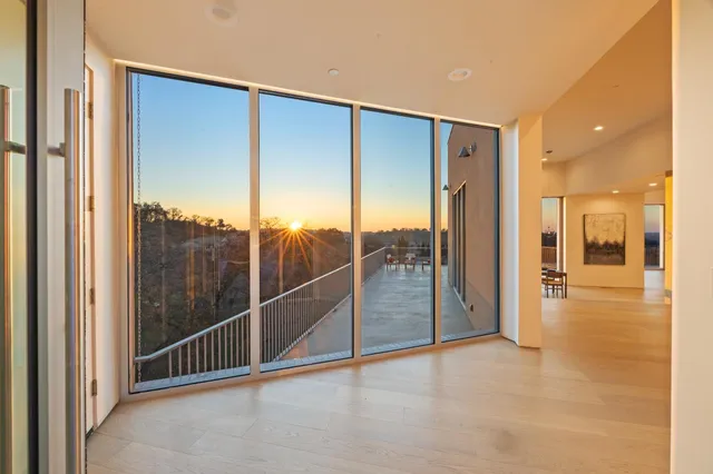 a view of a living room and a balcony