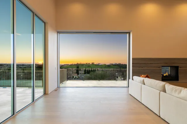 a view of living room with furniture and window