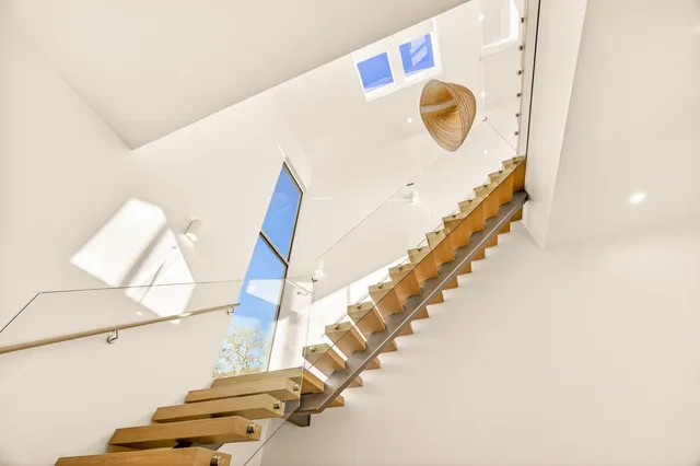 a view of a room with a table and chairs