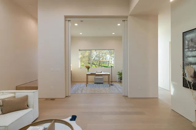a view of a building with a table and chairs