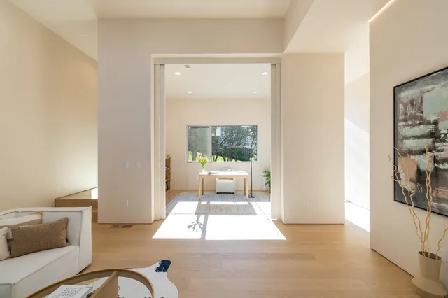 a aerial view of a house with a yard and balcony