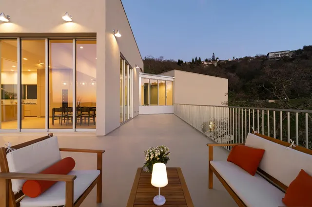 a view of a terrace with a garden and mountain view