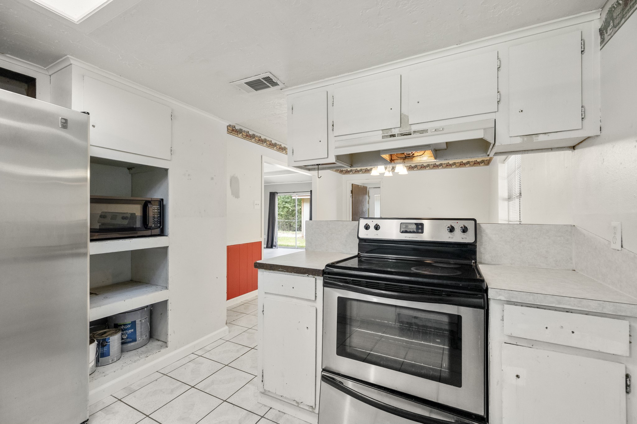 140 Friar Tuck Road Shepherd, TX 77371 - Photo 13 of 38 a kitchen with cabinets and appliances
