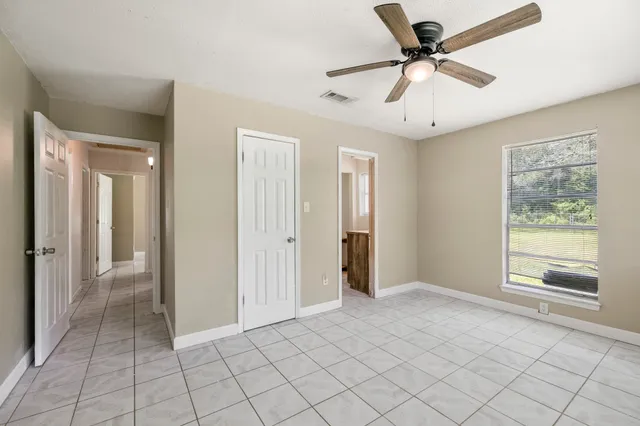 a view of an empty room and window