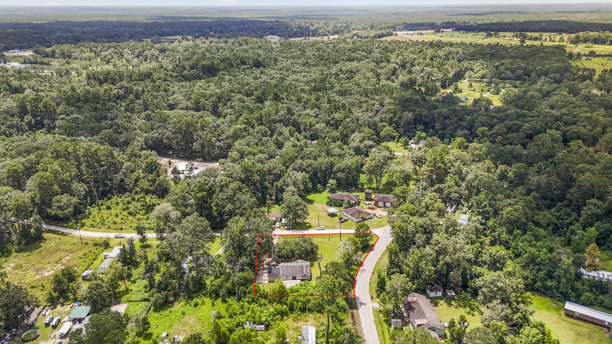 140 Friar Tuck Road Shepherd, TX 77371 - Photo 37 of 38 an aerial view of residential house with outdoor space and trees all around