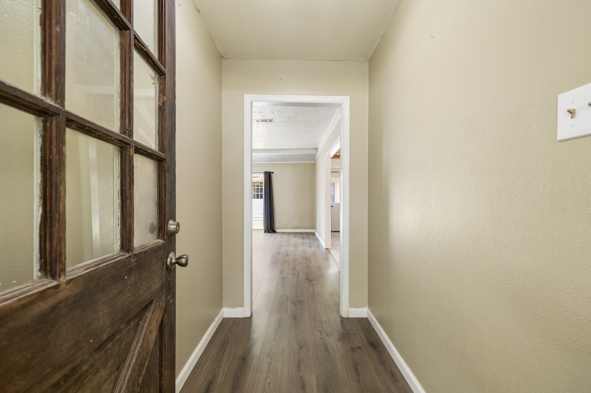 140 Friar Tuck Road Shepherd, TX 77371 - Photo 5 of 38 a view of a hallway with wooden floor and staircase