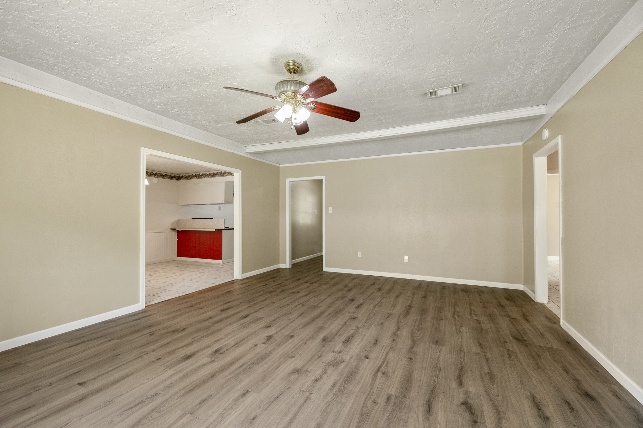 140 Friar Tuck Road Shepherd, TX 77371 - Photo 7 of 38 wooden floor in an empty room with a window