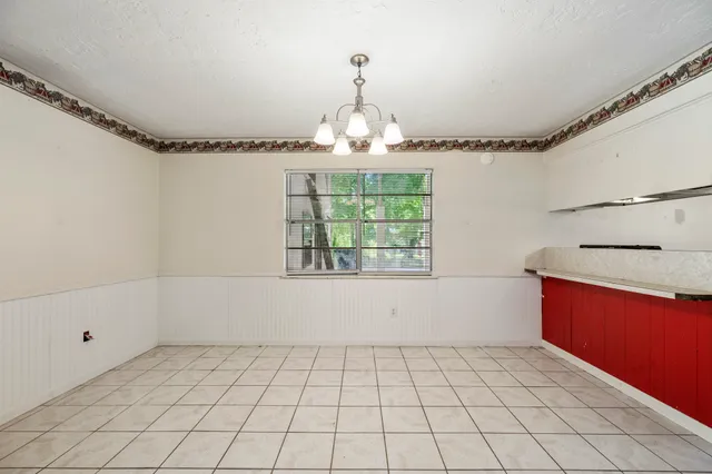 a view of an empty room and window
