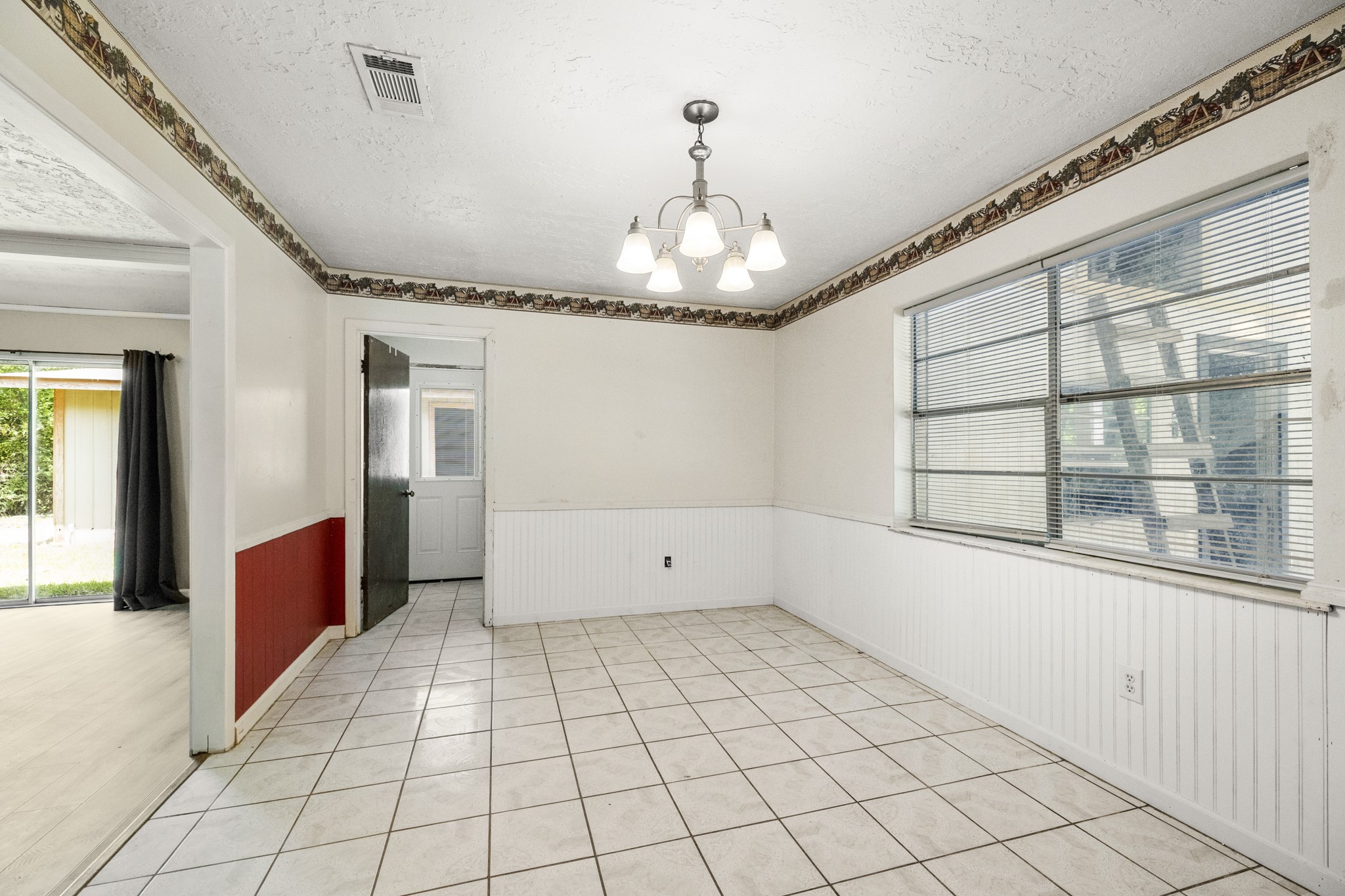 140 Friar Tuck Road Shepherd, TX 77371 - Photo 10 of 38 a view of empty room with wooden floor and fan