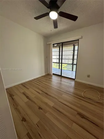 a view of a dining area with furniture window and wooden floor