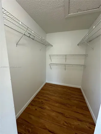 a view of livingroom with hardwood floor and ceiling fan