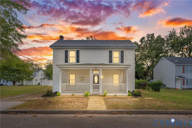 front view of a house with a yard