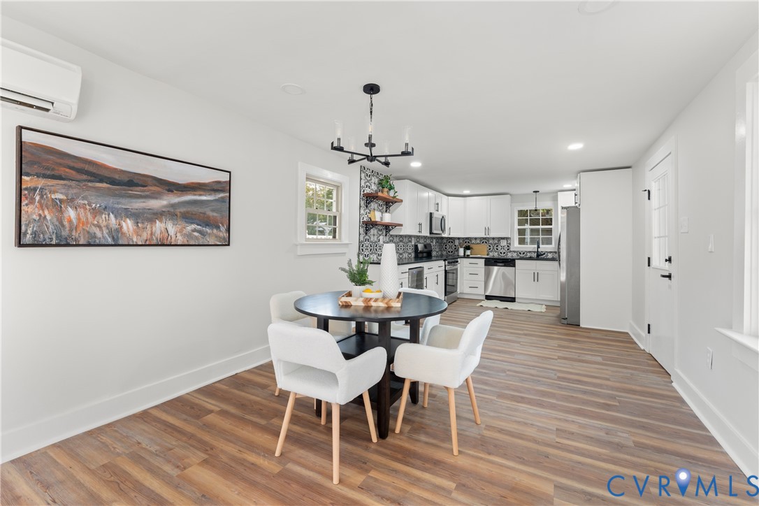 428 3rd Street West Point, VA 23181 - Photo 12 of 49 a view of a dining room with furniture wooden floor and chandelier