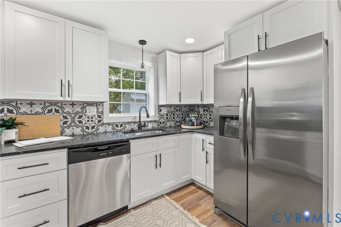 428 3rd Street West Point, VA 23181 - Photo 20 of 49 a kitchen with a refrigerator and a sink