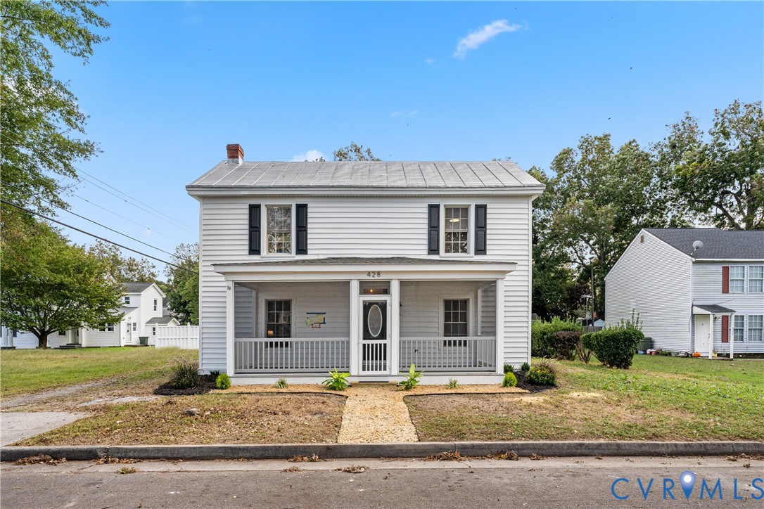 428 3rd Street West Point, VA 23181 - Photo 2 of 49 a front view of a house with garden