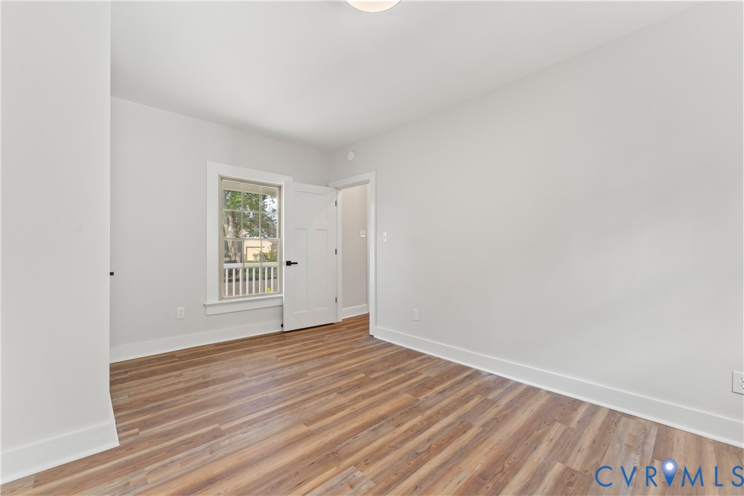 428 3rd Street West Point, VA 23181 - Photo 26 of 49 an empty room with wooden floor and windows