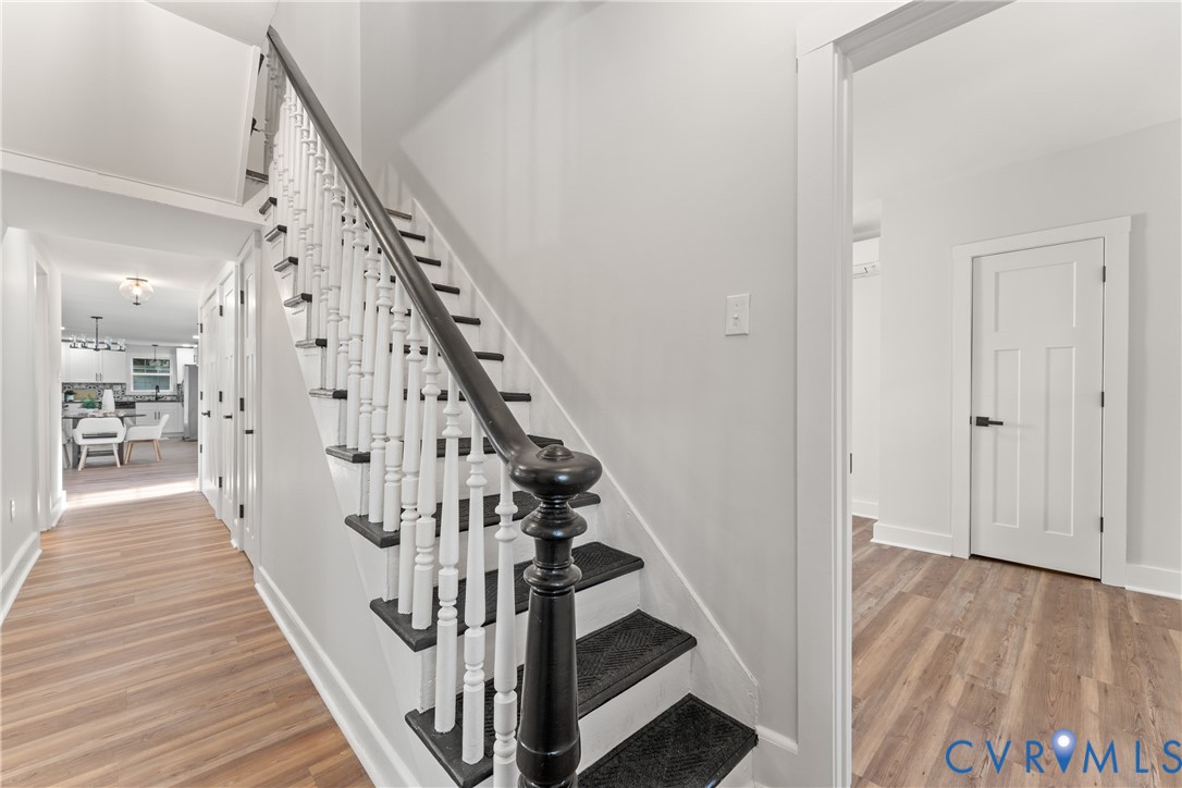 428 3rd Street West Point, VA 23181 - Photo 27 of 49 a view of a hallway with wooden floor and staircase