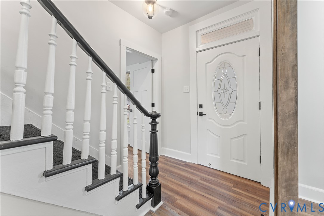 428 3rd Street West Point, VA 23181 - Photo 28 of 49 a view of a hallway with wooden floor and staircase