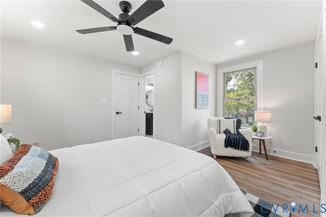 428 3rd Street West Point, VA 23181 - Photo 30 of 49 a bedroom with a bed and a chandelier