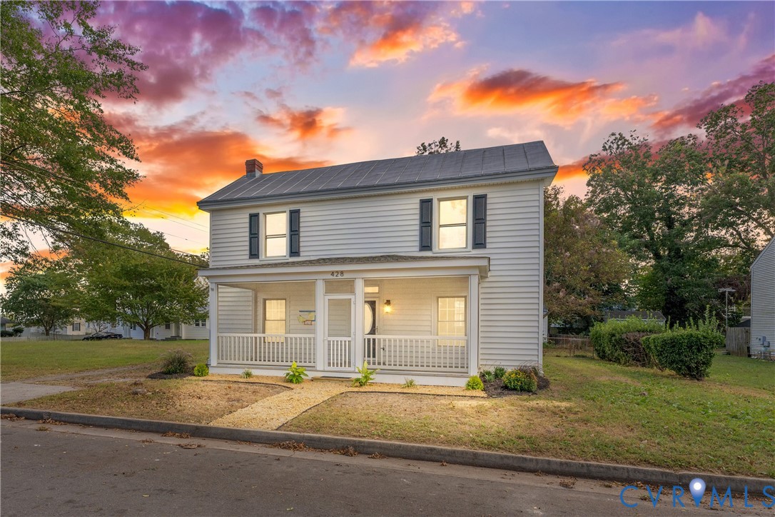 428 3rd Street West Point, VA 23181 - Photo 4 of 49 a front view of a house with a yard and garage