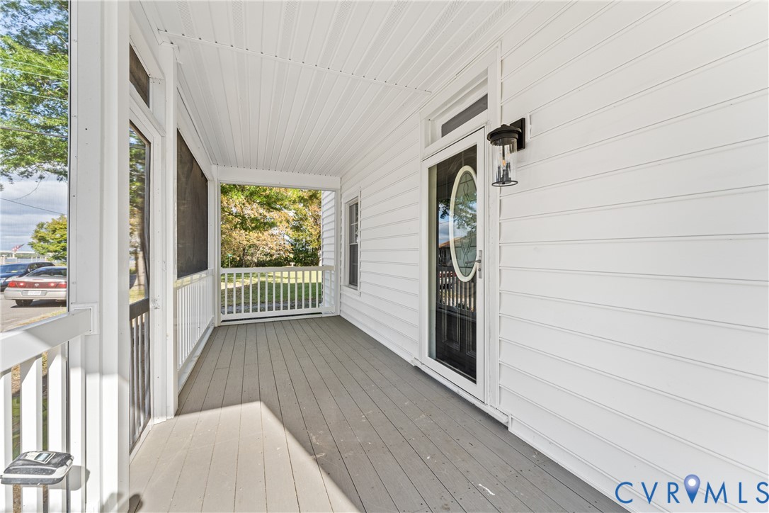428 3rd Street West Point, VA 23181 - Photo 5 of 49 a view of a porch with wooden floor and stairs