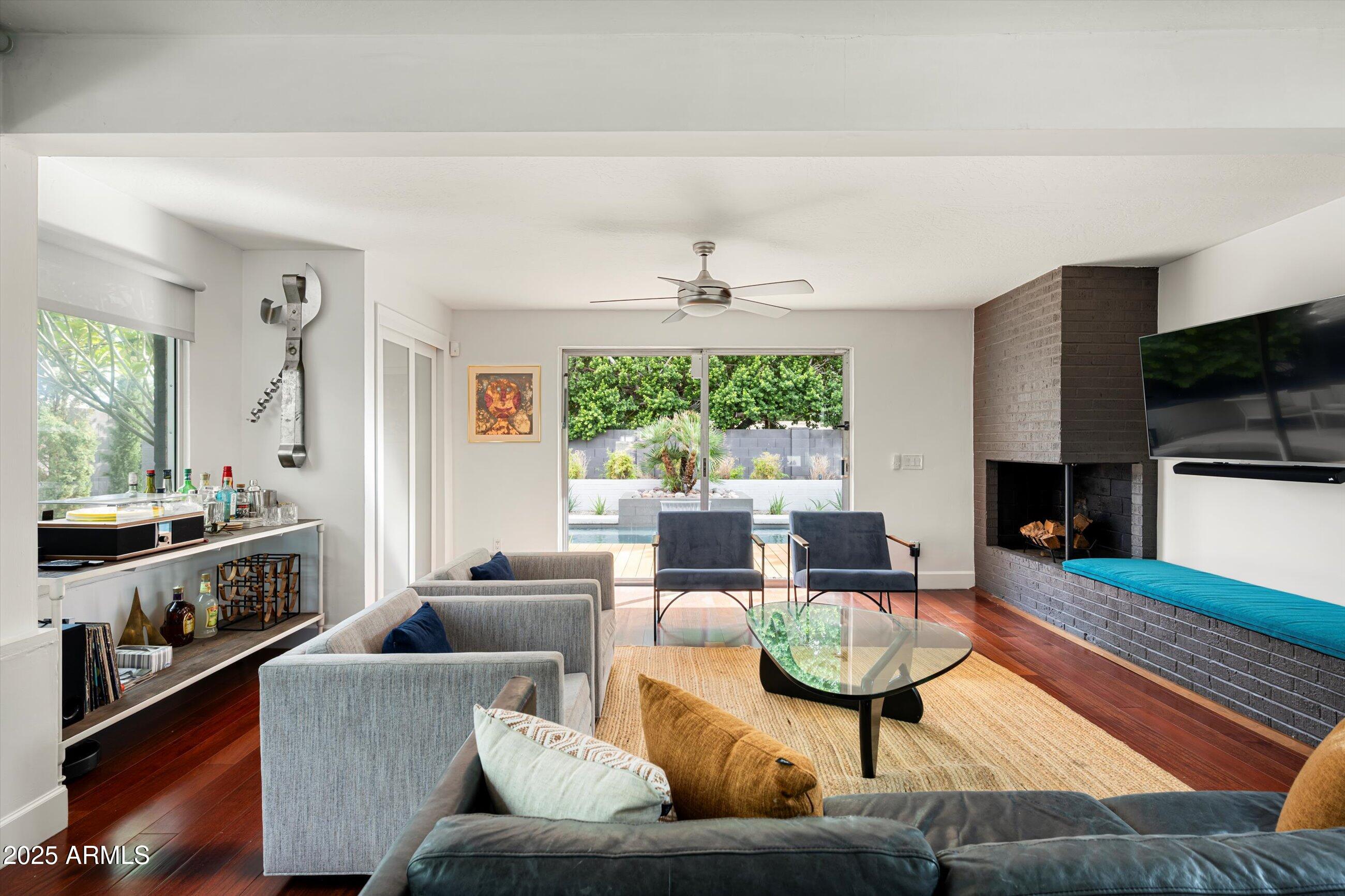 1651 East Rovey Avenue Phoenix, AZ 85016 - Photo 10 of 44 a living room with furniture fireplace and a large window