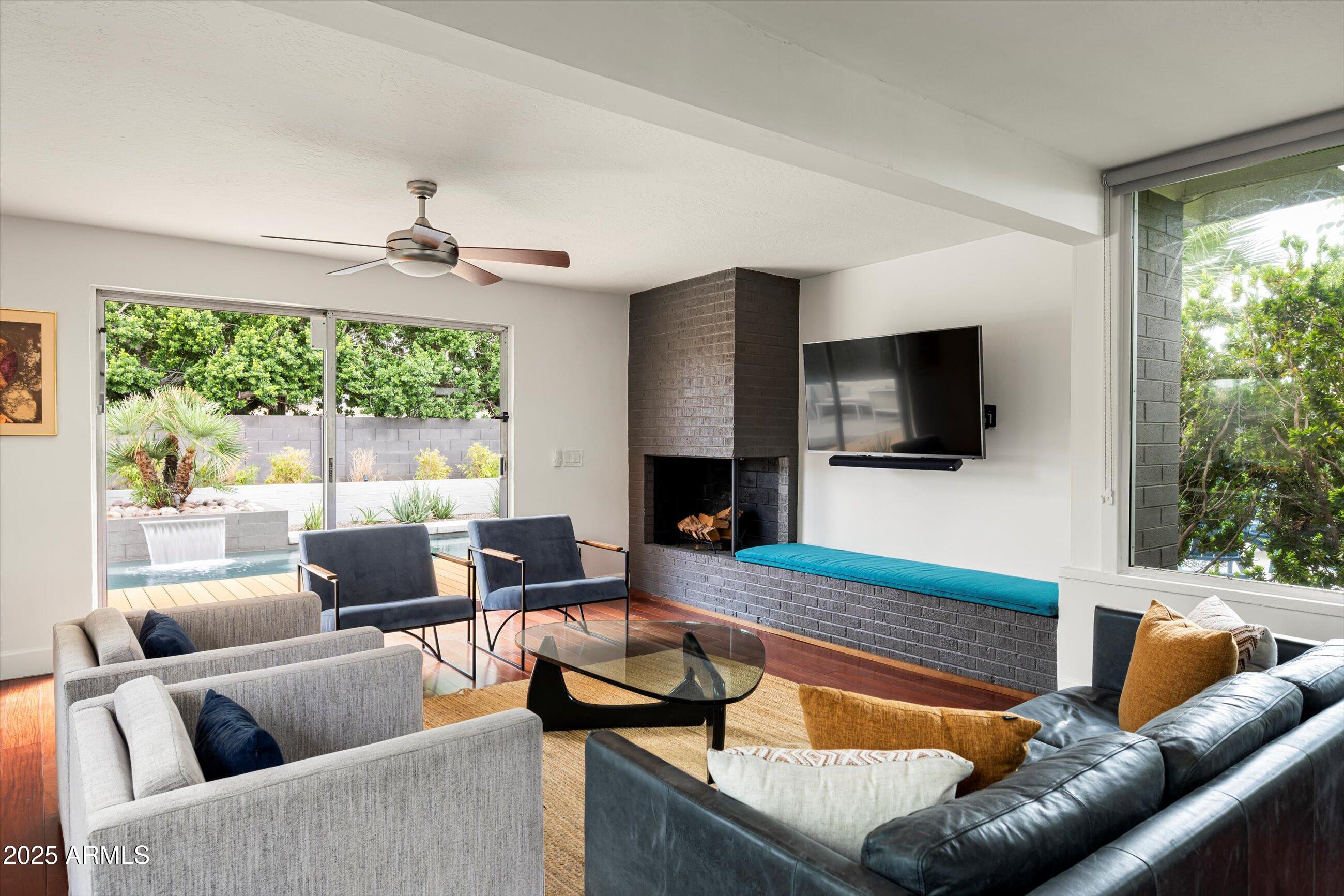 1651 East Rovey Avenue Phoenix, AZ 85016 - Photo 11 of 44 a living room with furniture and a flat screen tv