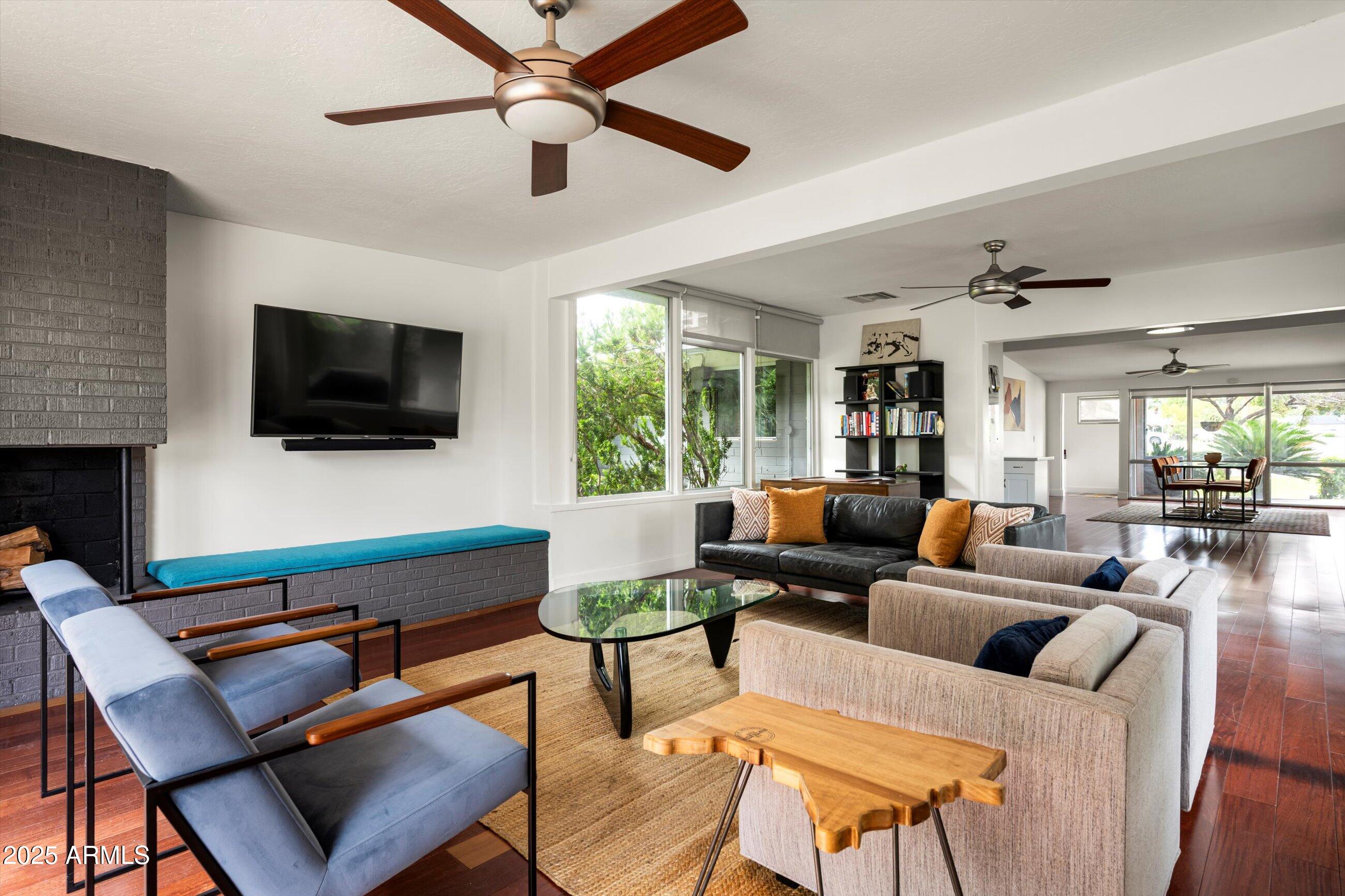 1651 East Rovey Avenue Phoenix, AZ 85016 - Photo 13 of 44 a living room with furniture and a flat screen tv