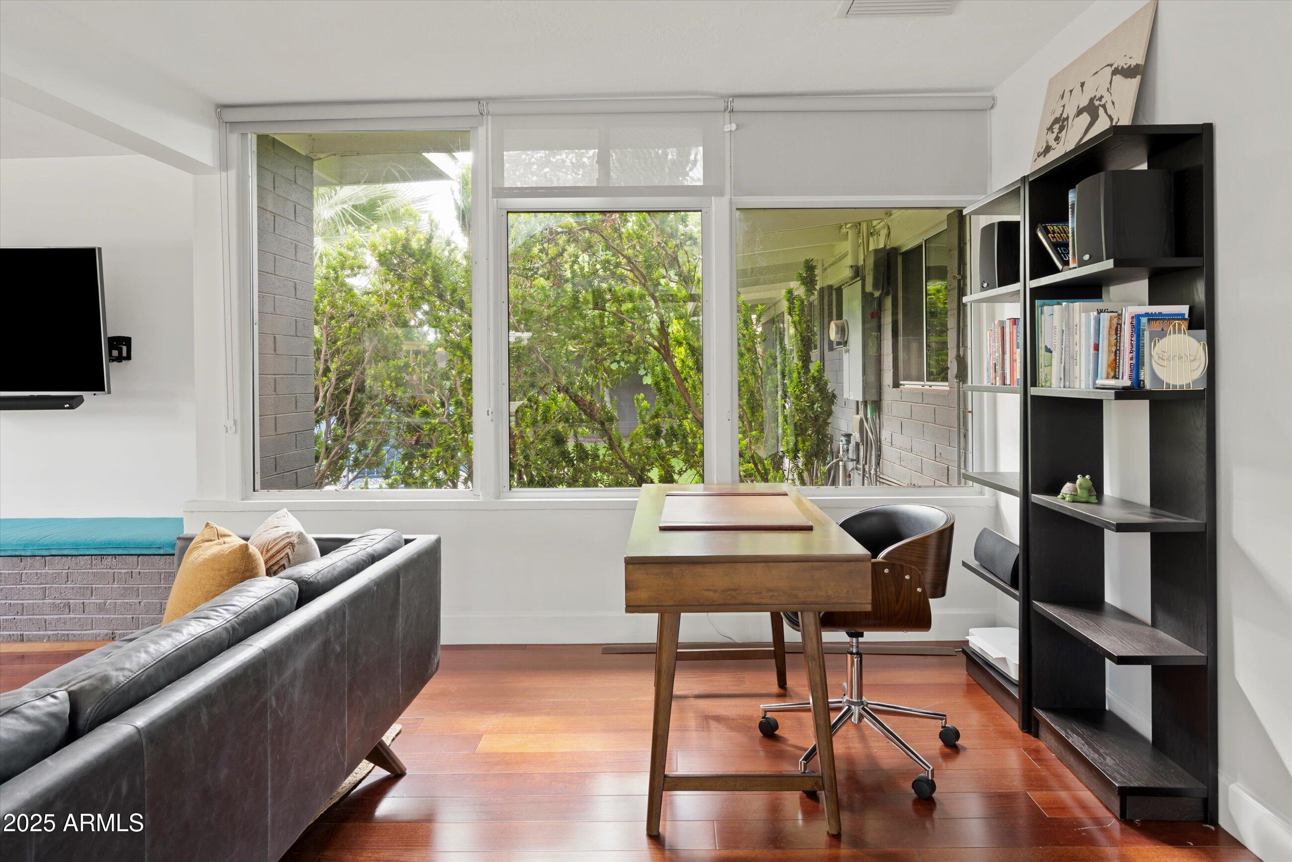 1651 East Rovey Avenue Phoenix, AZ 85016 - Photo 14 of 44 a living room with furniture and a flat screen tv