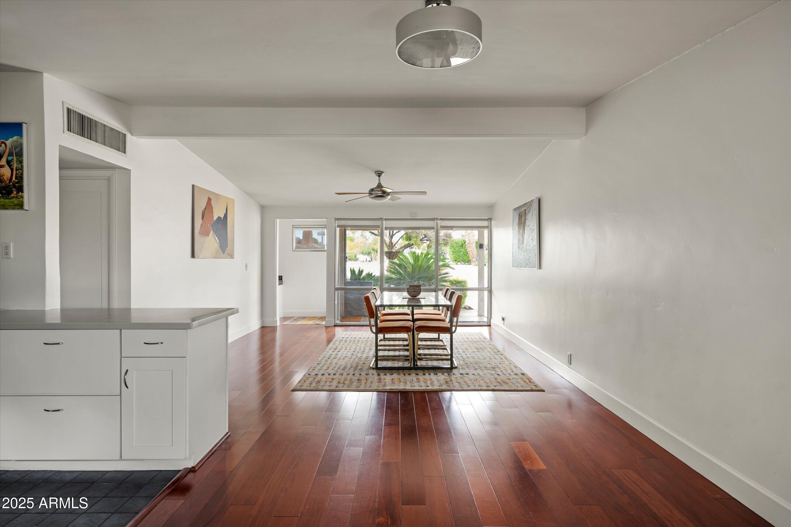 1651 East Rovey Avenue Phoenix, AZ 85016 - Photo 18 of 44 wooden floor in an empty room with a window
