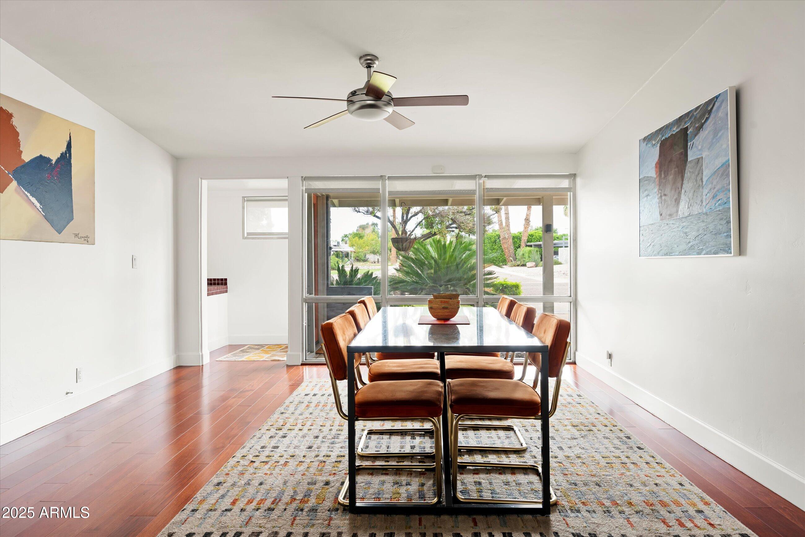 1651 East Rovey Avenue Phoenix, AZ 85016 - Photo 19 of 44 a dining room with furniture window and wooden floor