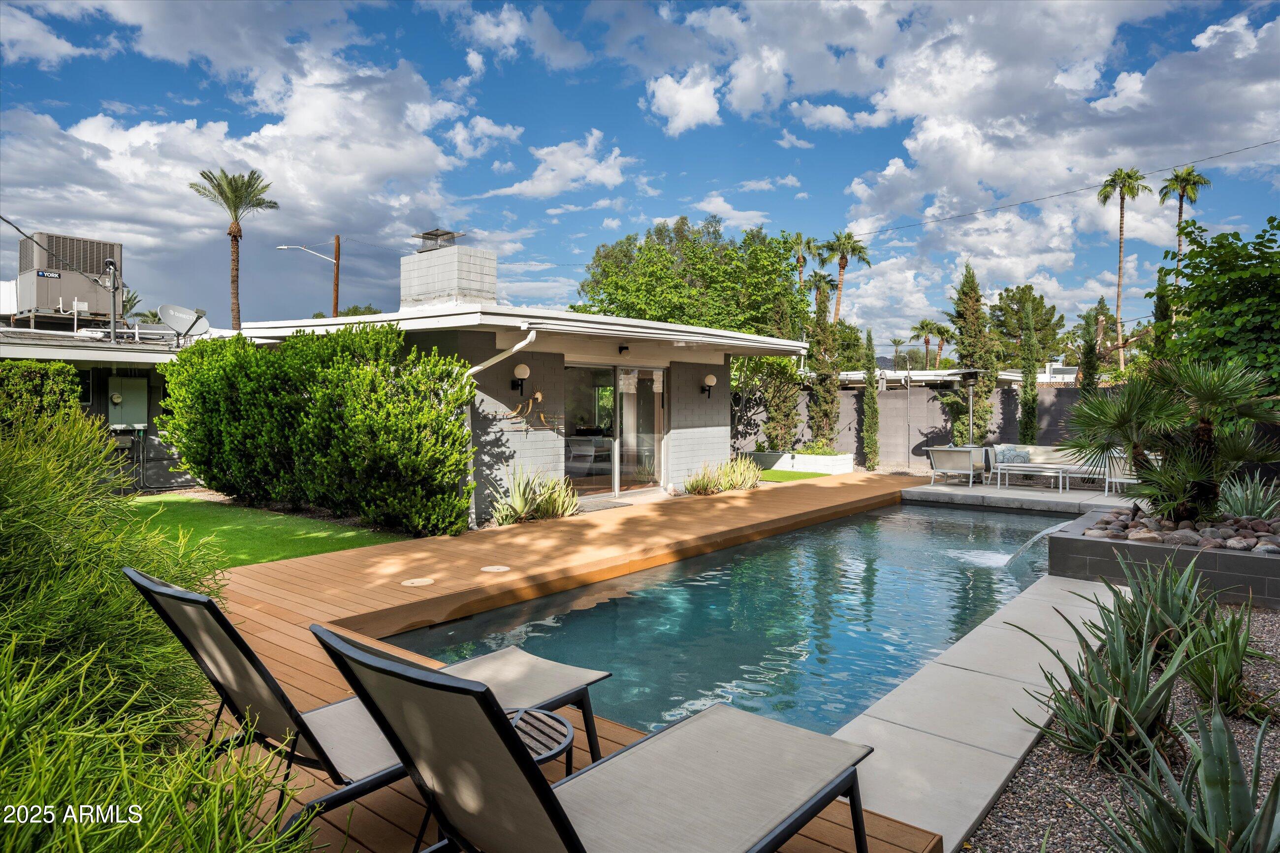 1651 East Rovey Avenue Phoenix, AZ 85016 - Photo 2 of 44 a view of house with swimming pool and outdoor seating
