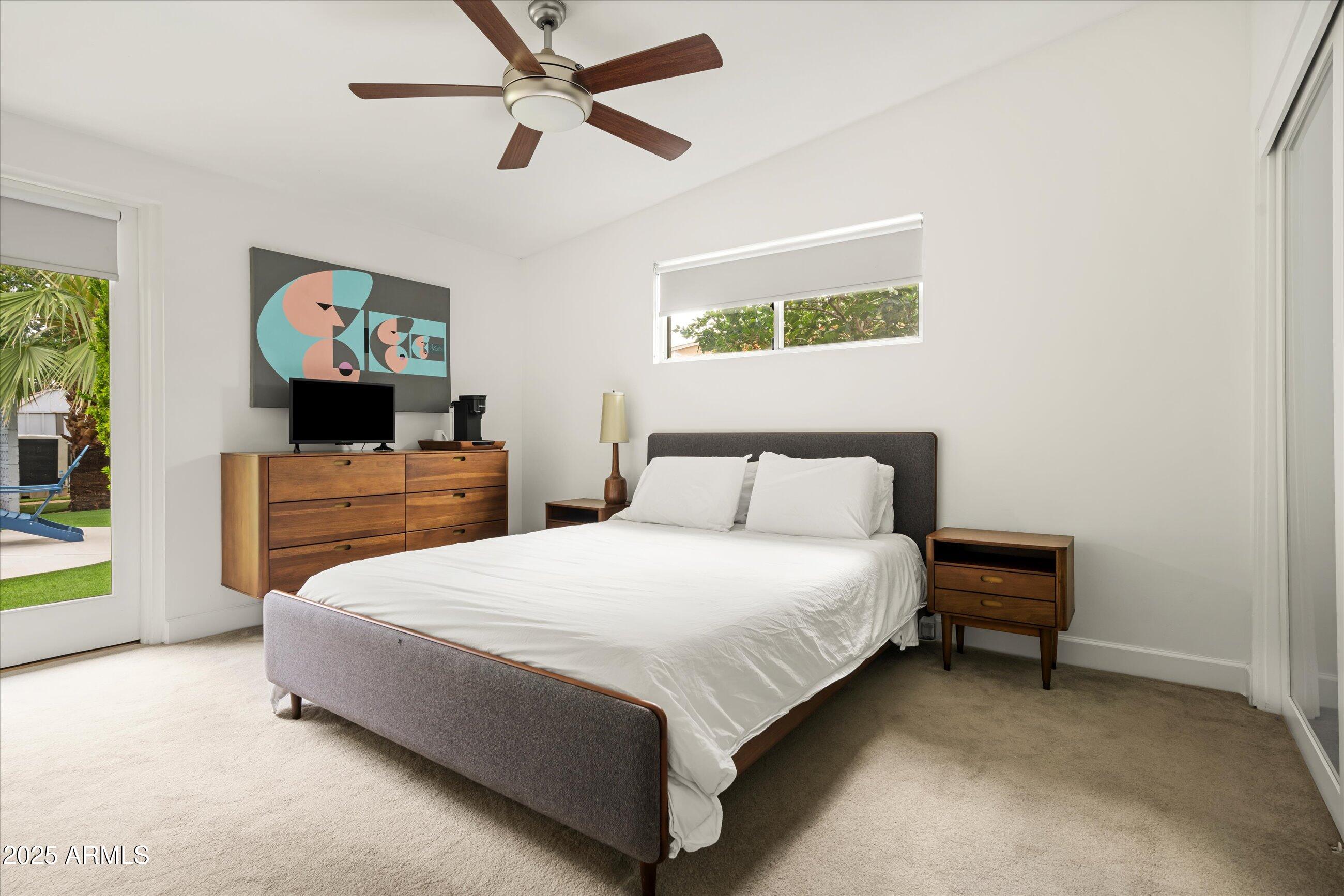 1651 East Rovey Avenue Phoenix, AZ 85016 - Photo 20 of 44 a bedroom with a bed and a flat screen tv