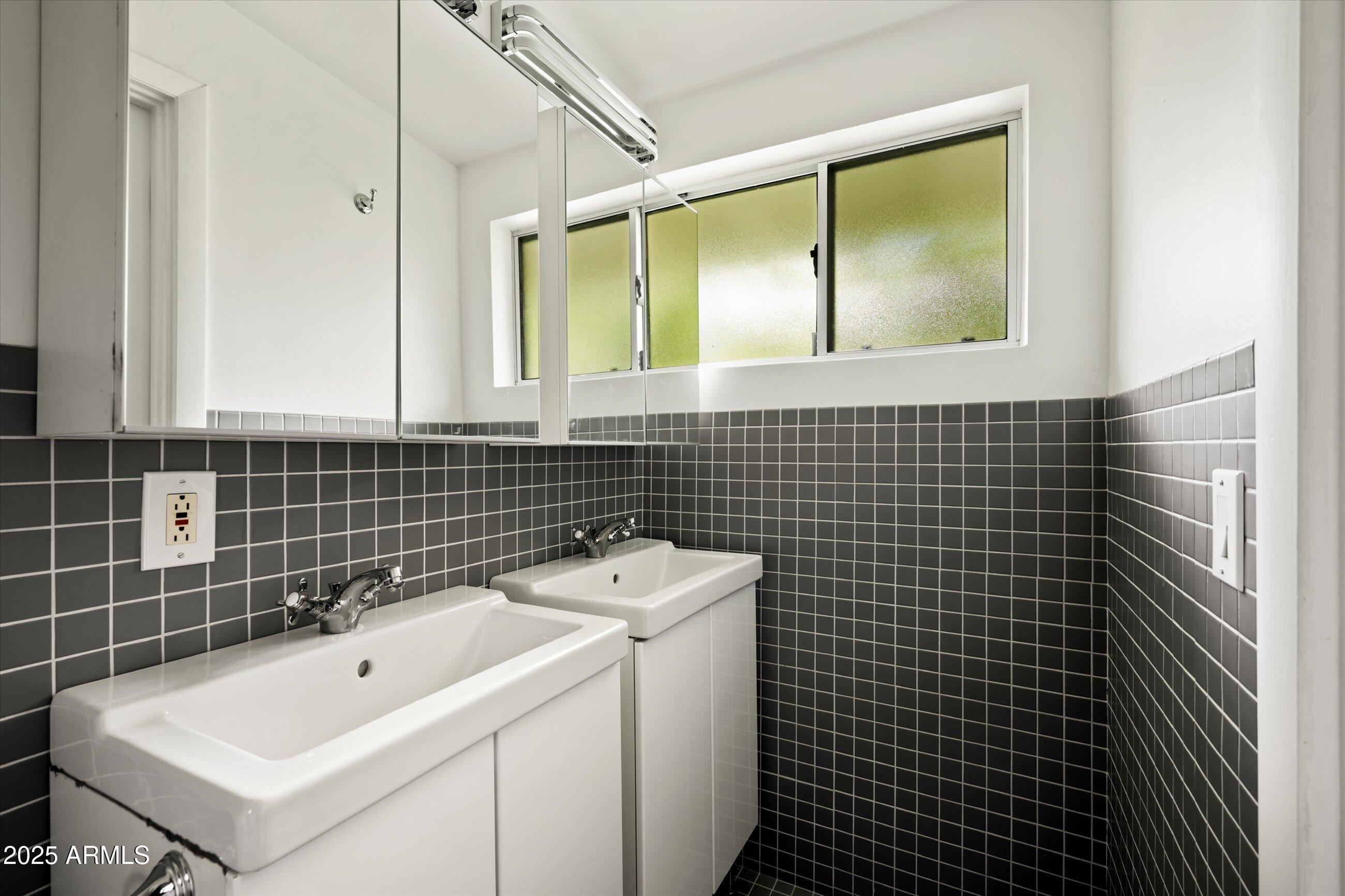 1651 East Rovey Avenue Phoenix, AZ 85016 - Photo 22 of 44 a bathroom with a sink toilet shower and mirror